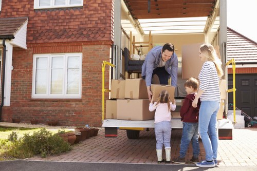 A local man and van moving service in Coulsdon loading household items