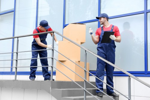 Removal team planning a move in a Coulsdon residential street