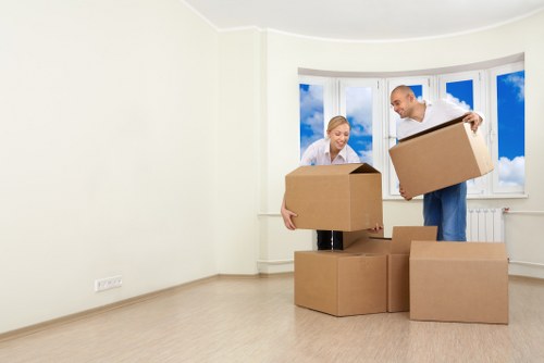 Removal workers loading household items for a Coulsdon move